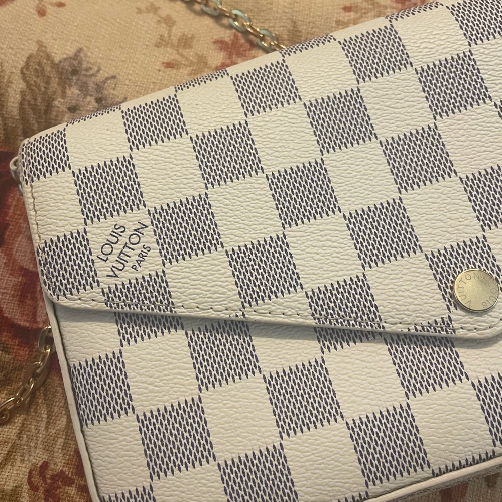 LV purse with stain